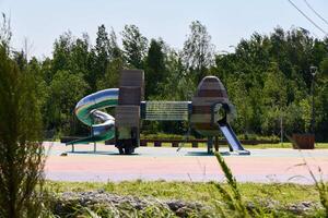 A Modern Playground Featuring Exciting Slides and Engaging Climbing Structures for Children photo
