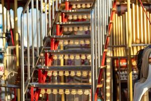 Stairs Leading to a Colorful Carousel Adorned With Lights During Late Afternoon photo