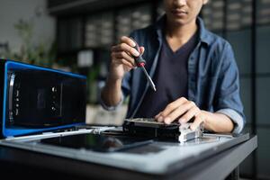 IT Engineer man working on a laptop computer photo