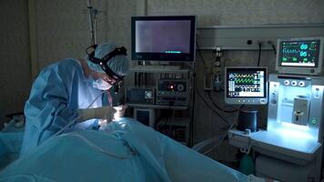 Highly skilled surgeon meticulously performs a complex surgical procedure, utilizing advanced medical equipment in a sterile operating room environment, demonstrating precision and expertise video