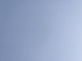 Clear Blue Sky A clear blue sky with minimal clouds, evoking a sense of calm and openness. photo