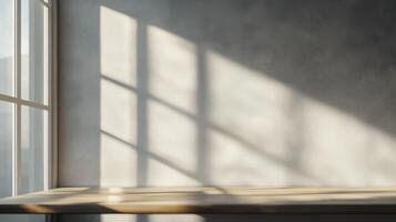 Sunlight and window shadow on white wall and wooden table surface photo
