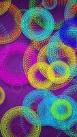 This looping 3D animation features cartoon-style rings with zigzag patterns rotating against a backdrop, resembling colorful ripples on water. Cycle animation. video
