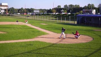 Wide Shot of Baseball Game in Progress on Sunny Day video