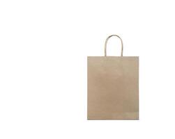Blank brown kraft paper bag on white background. Eco-friendly shopping bag made of recycled paper. Template with copy space. photo