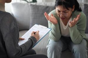 Psychologist doctor examine listen and talking to patient with depression, anxiety, therapy photo