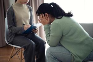 therapist Psychologist doctor examine and listen and talking to patient with depression, anxiety, therapy photo