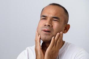Man has facial swellen due to an allergic reaction to triggers such as insect bites, food photo