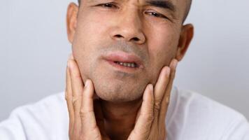 The Man has facial swelling due to an allergic reaction to triggers such as insect bites, food photo