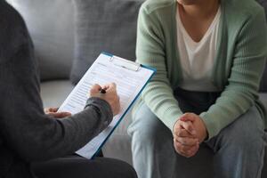 Psychologist examine and listen and talking to patient with depression, anxiety, therapy photo
