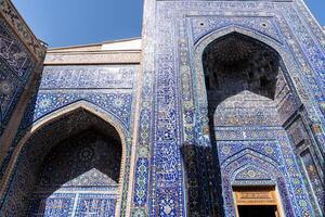 Samarkand, Uzbekistan- august 13, 2023-Particular of Shakhi Zinda necropolis, a famous mausoleum complex in Samarkand during a sunny day. photo