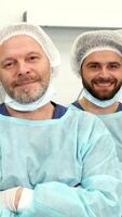 Confident surgical team stands ready in the operating room video