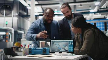 Black engineering specialists reviewing operational workflows in solar power manufacturing plant. Engineers integrating teamwork in alternative energy production line and development. Camera B. video