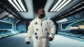 Astronaut walking inside futuristic spacecraft, preparing for scientific mission. Spaceship crew member in advanced spacesuit exiting station to do planetary exploration, camera A video