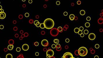Abstract flying red and yellow bubbles on black background. quickly motion. video