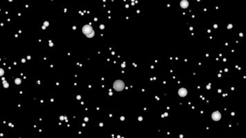Flying balls go into the center on black background. stars in the universe. video