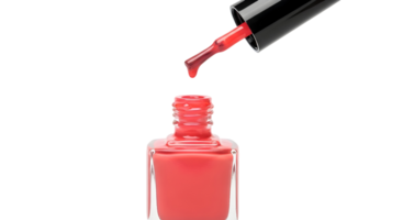 A close up shot of a red nail polish bottle with a drop falling from the applicator brush png