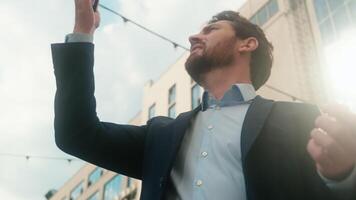 Middle-aged Caucasian business man confused with mobile phone lost signal Wi-Fi connection problem in city frustrated businessman male outside office holding smartphone searching connect online fail video