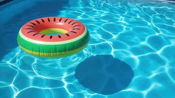 Watermelon Float Toy in Sparkling Blue Swimming Pool photo