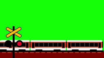 A modern train passes through a railway crossing with trees and signal poles in a calm, green field under clear weather conditions video