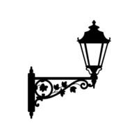 Ornate Wall-Mounted Lantern Elegant silhouette of a vintage wall-mounted lantern with ornate scrollwork and leaf details. Perfect for design projects needing a touch of old-world charm. vector