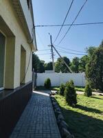 Sunny day view of a residential area with power lines photo