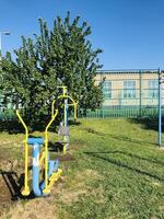 Exercise equipment for individuals with special needs in public park.. photo