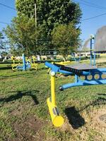 Exercise equipment for individuals with special needs in a park, photo