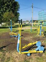 Exercise equipment for individuals with special needs in public park. photo