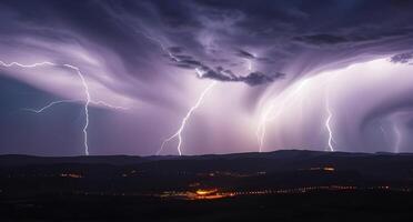 Lightning strikes over a mountain range photo
