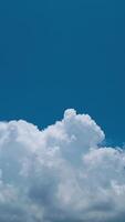 A plane flying in the sky with a cloud in the background photo