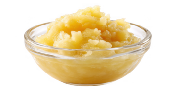 Glass bowl overflowing with delicious golden applesauce on transparent background png
