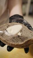 Chef Using Spoon To Spread Mayonnaise On The Wholemeal Bread For Burger video