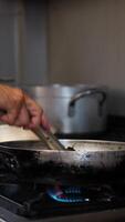 Chef Using Tongs Cooking Spaghetti Pasta With Mussels In The Pan video