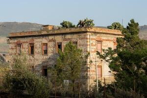 Abandoned building with cactuses in it, Sicily photo