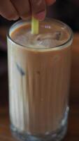 Chilled beverage preparation with ice and straw stirring video