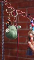 Colorful handmade keychains displayed at craft fair video