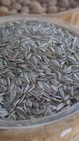 Sunflower seeds in a wooden bowl ready for snacking video
