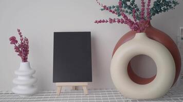 Decorative vase and blackboard arrangement in modern space video
