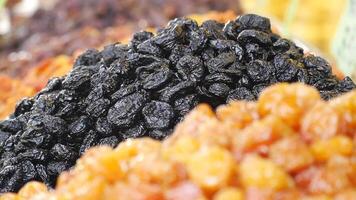 Dried fruits displayed at local market in vibrant colors video
