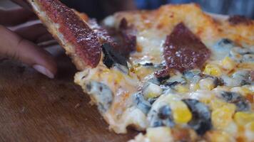 Enjoying a delicious slice of pizza at a local eatery video