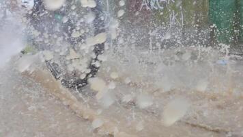 Bicycle Tire Splashing Through a Puddle. Slow Motion video