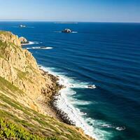 A view of the ocean from a cliff overlooking the ocean photo