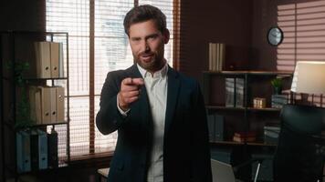 Smiling positive business man pointing index finger hey you choosing showing thumb up like Caucasian middle-aged businessman male worker in office looking at camera happy recommend support good job video