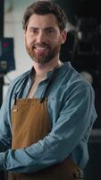 Caucasian man working in factory roasted coffee beans writing paper note check roasting machine male inspector technologist industry male guy in apron smiling looking at camera professional barista video