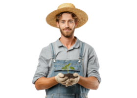 Smiling farmer in straw hat and overalls holding small plant seedling with soil in gloved hands, isolated on transparent background. Farming, growth, agriculture. png