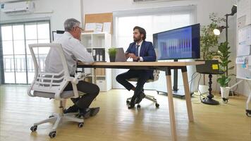 In a contemporary office, two senior executives with a mission to brainstorm and monitor the progress of a business project video