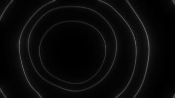 Expanding glowing rings creating concentric circles on black background video