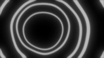 Expanding concentric white circles animation on black background video