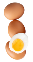 Top view of raw brown chicken eggs and cooked or boiled chicken egg with egg yolk in half in pile or stack isolated with clipping path in file format png